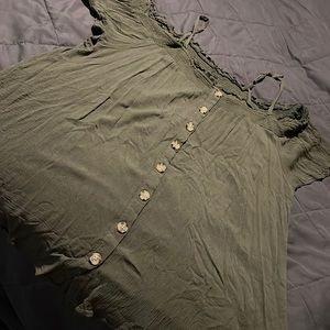 Torrid Green off the should button down top. Only worn a few times.